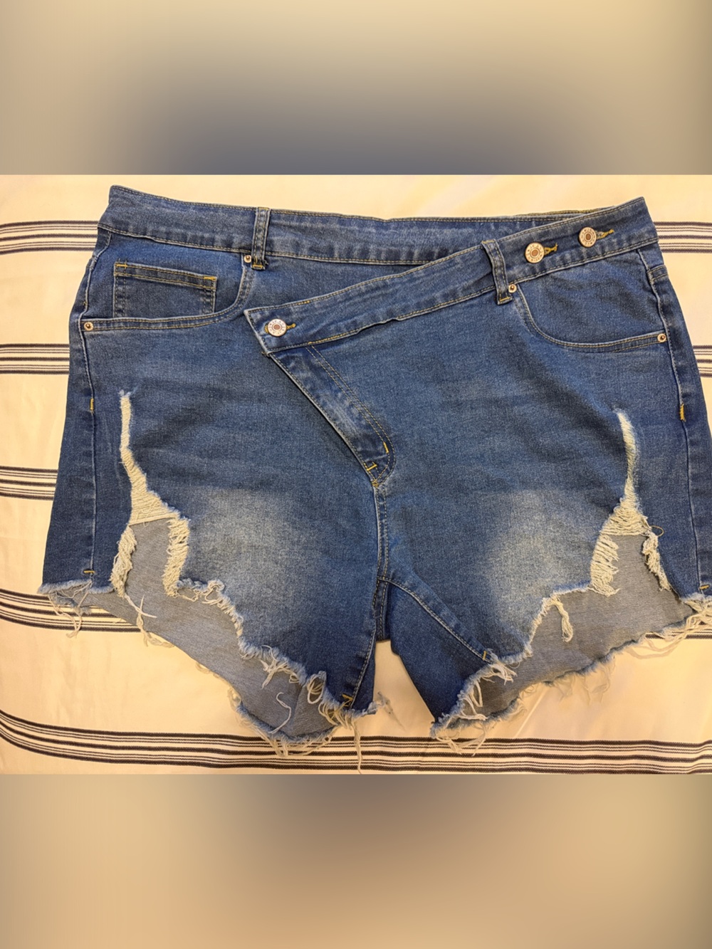 Asymmetrical wrap front Medium Blue Frayed Denim Shorts